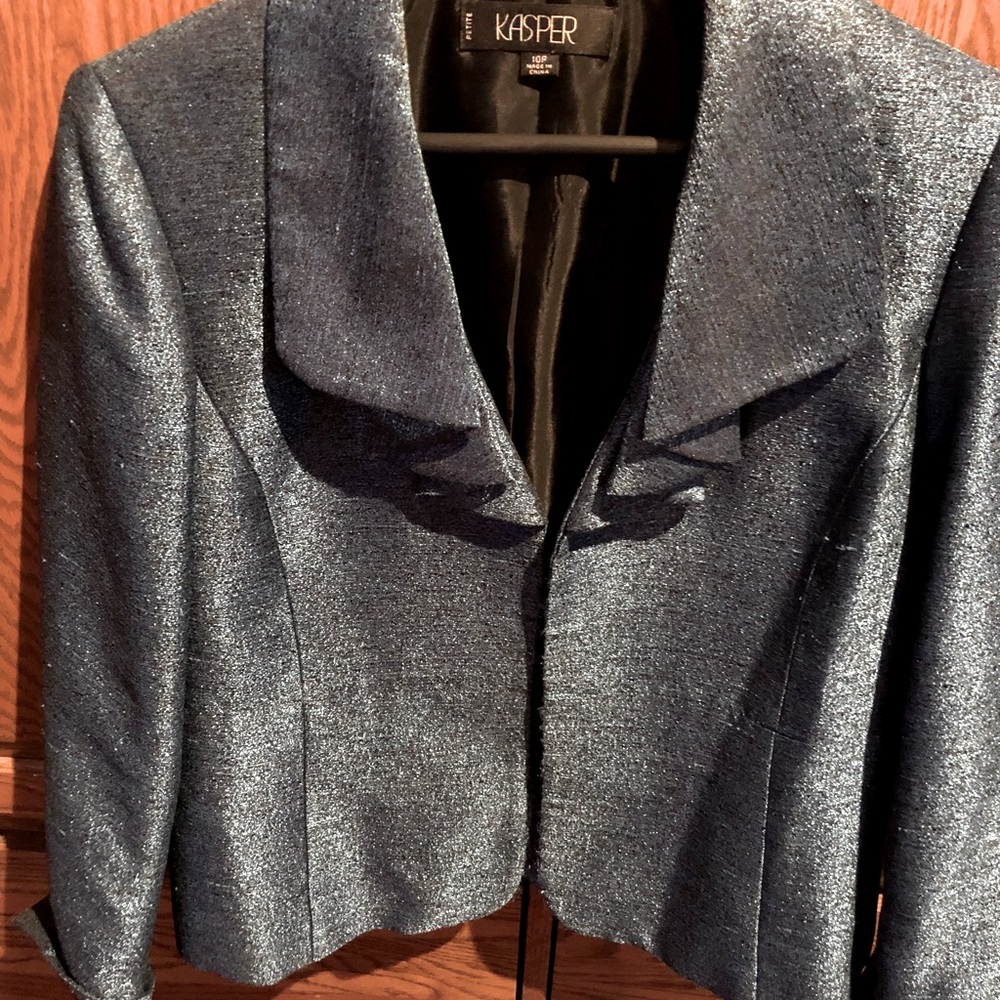 Shiny French Blue Jacket, waist length, open wide collar and cuffed sleeves.